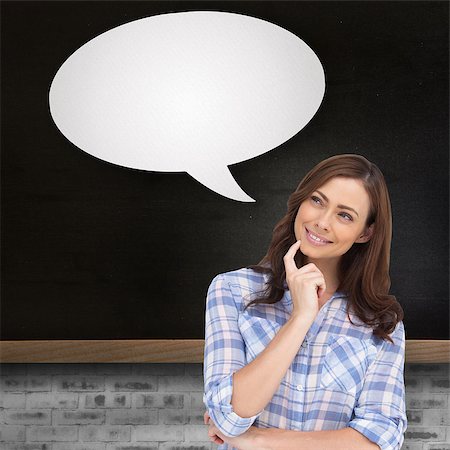 Thoughtful woman with speech bubble placing her finger on her chin against blackboard on wall Stock Photo - Budget Royalty-Free & Subscription, Code: 400-07512128