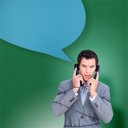 Angry businessman tangles up in phone wires with speech bubble against green vignette Stock Photo - Budget Royalty-Free & Subscription, Code: 400-07512130