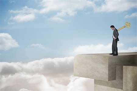 Wound up businessman with hands on hips on balcony and bright sky Photographie de stock - Aubaine LD & Abonnement, Code: 400-07512522