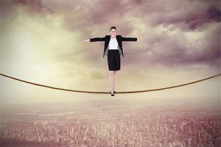 Businesswoman performing a balancing act against balcony overlooking city Stock Photo - Budget Royalty-Free & Subscription, Code: 400-07512580