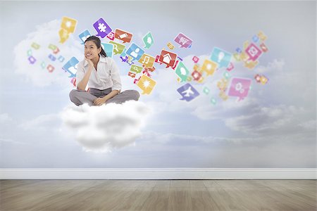 simsearch:400-08076534,k - Businesswoman sitting cross legged thinking against clouds in a room Foto de stock - Royalty-Free Super Valor e Assinatura, Número: 400-07512623