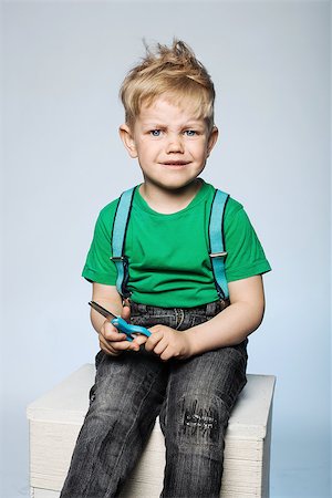 Unruly little boy with scissors Fotografie stock - Microstock e Abbonamento, Codice: 400-07512782
