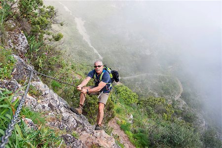 simsearch:400-08186089,k - Mature Man trekking in the mountain Photographie de stock - Aubaine LD & Abonnement, Code: 400-07513410