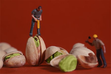 Miniature Construction Workers in Conceptual Food Imagery With Pistachio Nuts Stock Photo - Budget Royalty-Free & Subscription, Code: 400-07513504