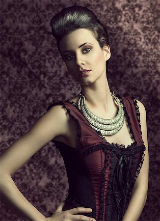 portrait of beautiful young woman in elegant old fashion purple dress , and a very importatnt necklace. hairdo. Stock Photo - Budget Royalty-Free & Subscription, Code: 400-07513775