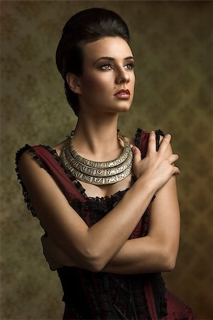 elegant old woman portrait - vintage portrait of beautiful young woman in elegant old fashion purple dress , important necklace looking on one side Stock Photo - Budget Royalty-Free & Subscription, Code: 400-07513776