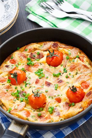 Delicious omelet with ham and cherry tomatoes Stock Photo - Budget Royalty-Free & Subscription, Code: 400-07513885