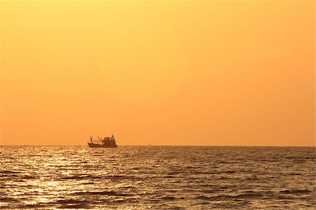 Fisherman boat at sunrise over Andaman sea Stock Photo - Budget Royalty-Free & Subscription, Code: 400-07524493