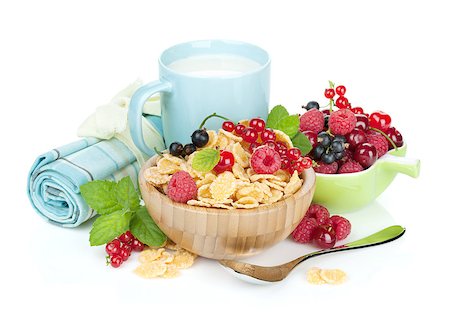 Fresh corn flakes with berries and milk cup. Isolated on white background Stock Photo - Budget Royalty-Free & Subscription, Code: 400-07524974