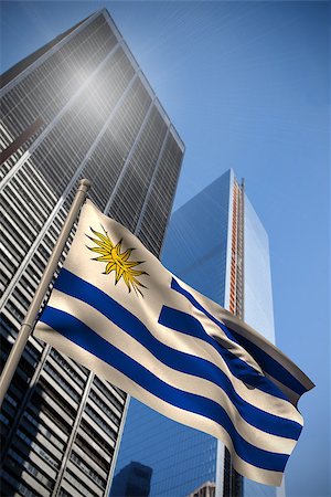 simsearch:400-07525974,k - Uruguay national flag against low angle view of skyscrapers Stock Photo - Budget Royalty-Free & Subscription, Code: 400-07525976