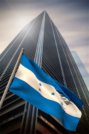 simsearch:400-07525974,k - Honduras national flag against low angle view of skyscraper Stock Photo - Budget Royalty-Free & Subscription, Code: 400-07525972