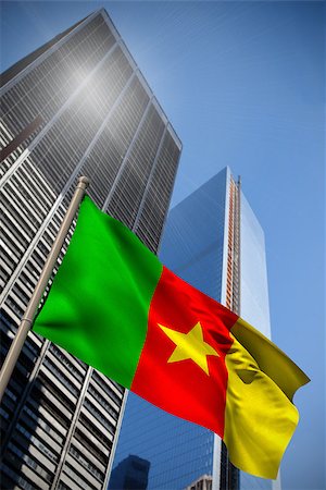 simsearch:400-07525974,k - Cameroon national flag against low angle view of skyscrapers Stock Photo - Budget Royalty-Free & Subscription, Code: 400-07525973