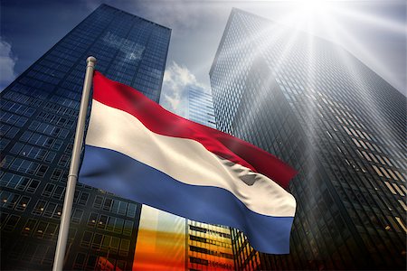 simsearch:400-07525974,k - Netherlands national flag against low angle view of skyscrapers at sunset Stock Photo - Budget Royalty-Free & Subscription, Code: 400-07526021