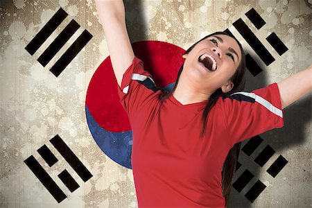 Composite image of excited asian football fan cheering against south korea flag Stock Photo - Budget Royalty-Free & Subscription, Code: 400-07526044