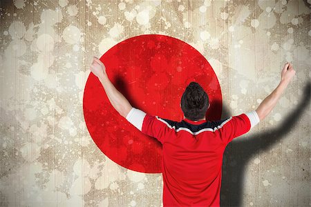 Composite image of excited football fan cheering against japan flag Stock Photo - Budget Royalty-Free & Subscription, Code: 400-07526045