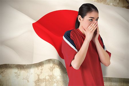 sport texture - Composite image of nervous football fan looking ahead against japan flag Stock Photo - Budget Royalty-Free & Subscription, Code: 400-07526051