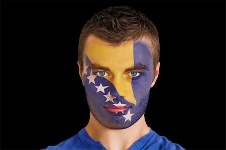 Composite image of serious young bosnian fan with facepaint against black Photographie de stock - Aubaine LD & Abonnement, Code: 400-07526422