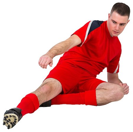 simsearch:400-07527479,k - Fit football player playing and kicking on white background Stock Photo - Budget Royalty-Free & Subscription, Code: 400-07526541