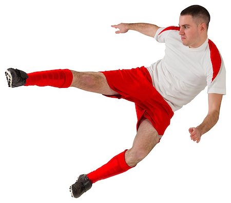 simsearch:400-07527479,k - Fit football player playing and kicking on white background Stock Photo - Budget Royalty-Free & Subscription, Code: 400-07526628