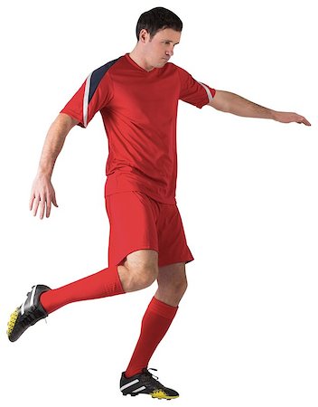 simsearch:400-07526712,k - Football player in red kicking on white background Stock Photo - Budget Royalty-Free & Subscription, Code: 400-07526714