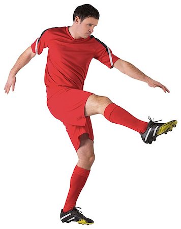 simsearch:400-07527479,k - Football player in red kicking on white background Stock Photo - Budget Royalty-Free & Subscription, Code: 400-07526715