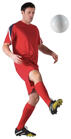 football man kicking white background - Football player in red kicking on white background Stock Photo - Budget Royalty-Free & Subscription, Code: 400-07526717