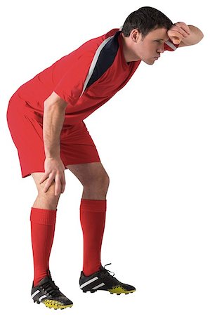 exhausted football player - Tired football player bending over on white background Stock Photo - Budget Royalty-Free & Subscription, Code: 400-07526718