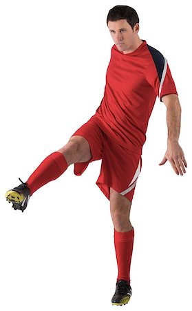 simsearch:400-07527479,k - Football player in red kicking on white background Stock Photo - Budget Royalty-Free & Subscription, Code: 400-07526710