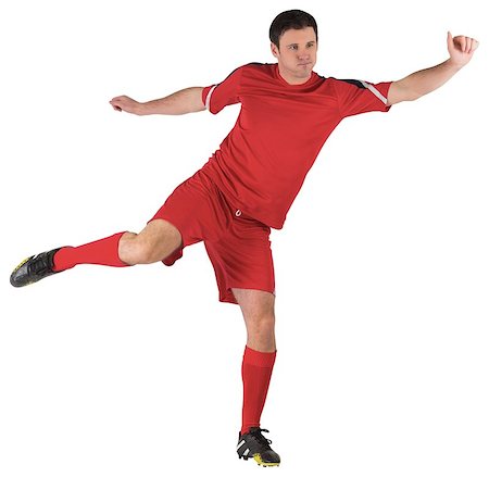 football man kicking white background - Football player in red kicking on white background Stock Photo - Budget Royalty-Free & Subscription, Code: 400-07526724