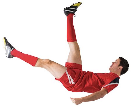 simsearch:400-07527479,k - Football player in red kicking on white background Stock Photo - Budget Royalty-Free & Subscription, Code: 400-07526728