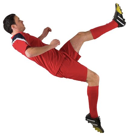 simsearch:400-07526712,k - Football player in red kicking on white background Stock Photo - Budget Royalty-Free & Subscription, Code: 400-07526729