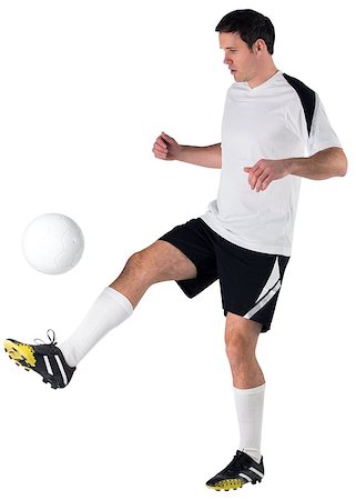 football man kicking white background - Football player in white kicking on white background Stock Photo - Budget Royalty-Free & Subscription, Code: 400-07526739