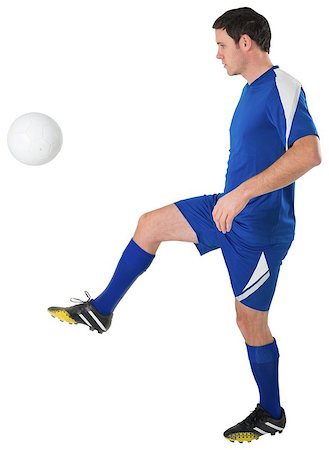 simsearch:400-07527479,k - Football player in blue kicking on white background Stock Photo - Budget Royalty-Free & Subscription, Code: 400-07526757