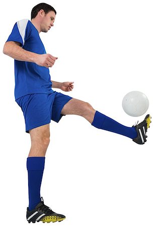 simsearch:400-07527479,k - Football player in blue kicking on white background Stock Photo - Budget Royalty-Free & Subscription, Code: 400-07526759