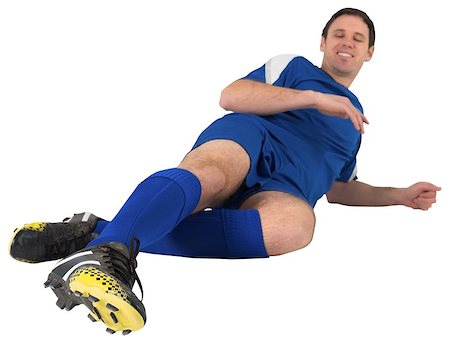 football man kicking white background - Football player in blue kicking on white background Stock Photo - Budget Royalty-Free & Subscription, Code: 400-07526750