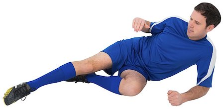 simsearch:400-07526712,k - Football player in blue kicking on white background Stock Photo - Budget Royalty-Free & Subscription, Code: 400-07526760