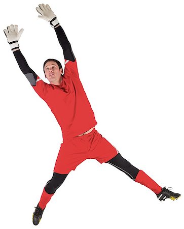 simsearch:400-07526712,k - Fit goal keeper jumping up on white background Stock Photo - Budget Royalty-Free & Subscription, Code: 400-07526800