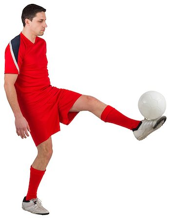 simsearch:400-07527479,k - Fit young football player kicking on white background Stock Photo - Budget Royalty-Free & Subscription, Code: 400-07526887