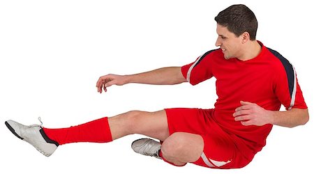 simsearch:400-07527479,k - Fit football player jumping and kicking on white background Stock Photo - Budget Royalty-Free & Subscription, Code: 400-07526890