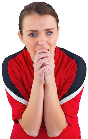 Nervous football fan in red on white Stock Photo - Budget Royalty-Free & Subscription, Code: 400-07526920