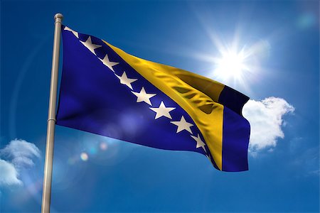 Bosnian national flag on flagpole on blue sky background Photographie de stock - Aubaine LD & Abonnement, Code: 400-07526975