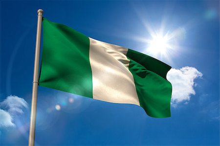 simsearch:841-02712636,k - Nigeria national flag on blue sky background Photographie de stock - Aubaine LD & Abonnement, Code: 400-07526995