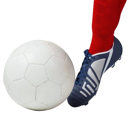 Football player kicking ball with boot on white background Stock Photo - Budget Royalty-Free & Subscription, Code: 400-07527121