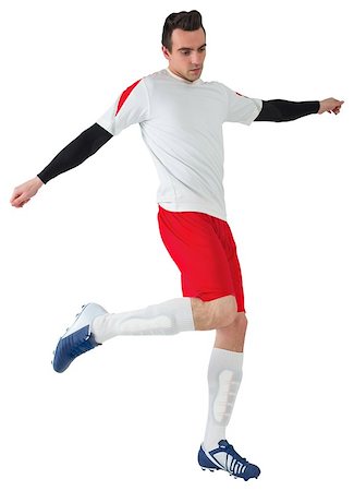 simsearch:400-07527479,k - Football player in white kicking on white background Stock Photo - Budget Royalty-Free & Subscription, Code: 400-07527205