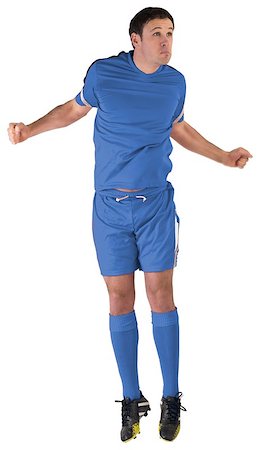 simsearch:400-07526712,k - Football player in blue jumping on white background Stock Photo - Budget Royalty-Free & Subscription, Code: 400-07527370