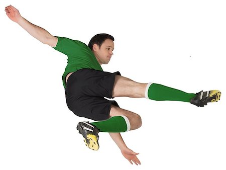 simsearch:400-07527479,k - Football player in green kicking on white background Stock Photo - Budget Royalty-Free & Subscription, Code: 400-07527372