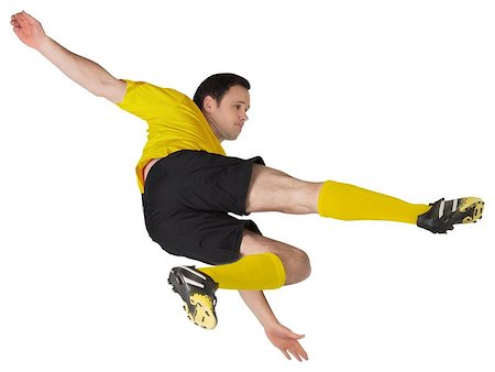 simsearch:400-07526712,k - Football player in yellow kicking on white background Stock Photo - Budget Royalty-Free & Subscription, Code: 400-07527373