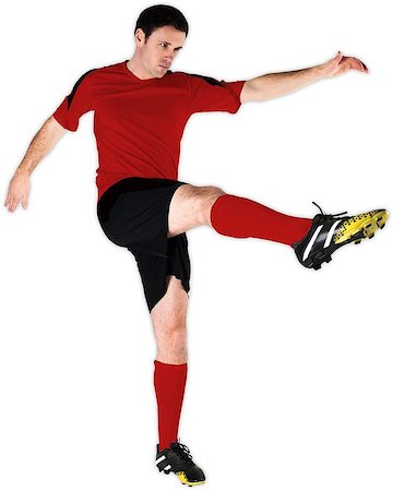 simsearch:400-07527479,k - Football player in red kicking on white background Stock Photo - Budget Royalty-Free & Subscription, Code: 400-07527477