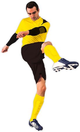 football man kicking white background - Football player in yellow kicking on white background Stock Photo - Budget Royalty-Free & Subscription, Code: 400-07527480