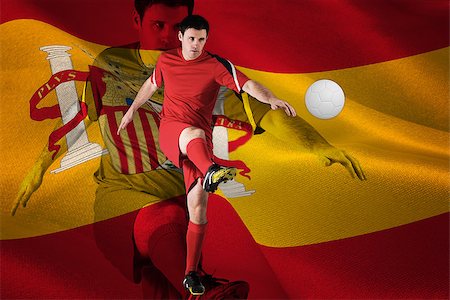 simsearch:400-07526712,k - Football player in red kicking against digitally generated spanish national flag Stock Photo - Budget Royalty-Free & Subscription, Code: 400-07527600